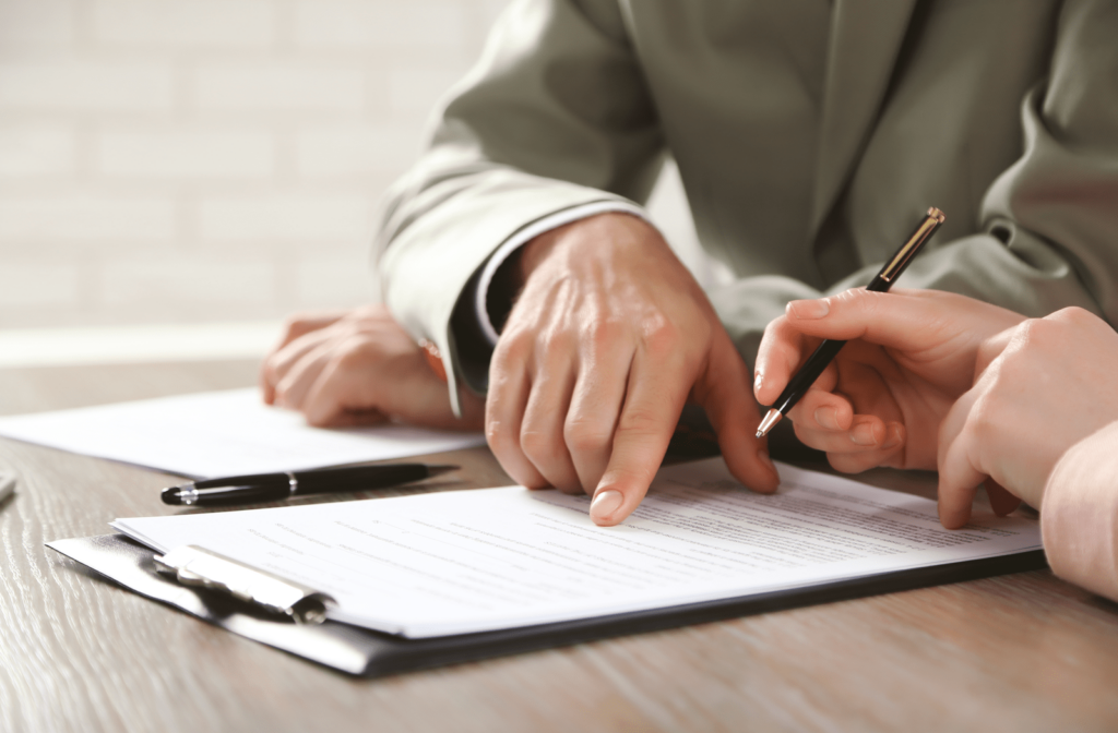 Lawyer reviewing a certificate of title with a client