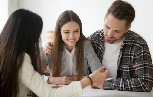 couple reviewing documents with lawyer