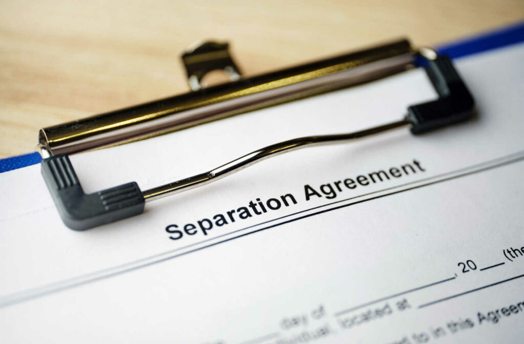 A close up view of a separation agreement to be signed by a married couple who have decided to separate.