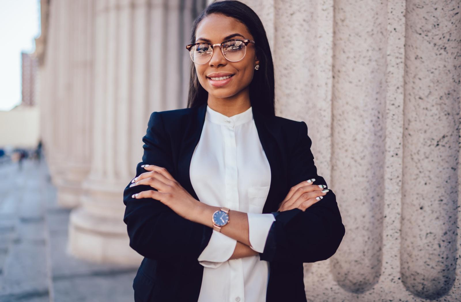 A woman lawyer standing outside a courthouse